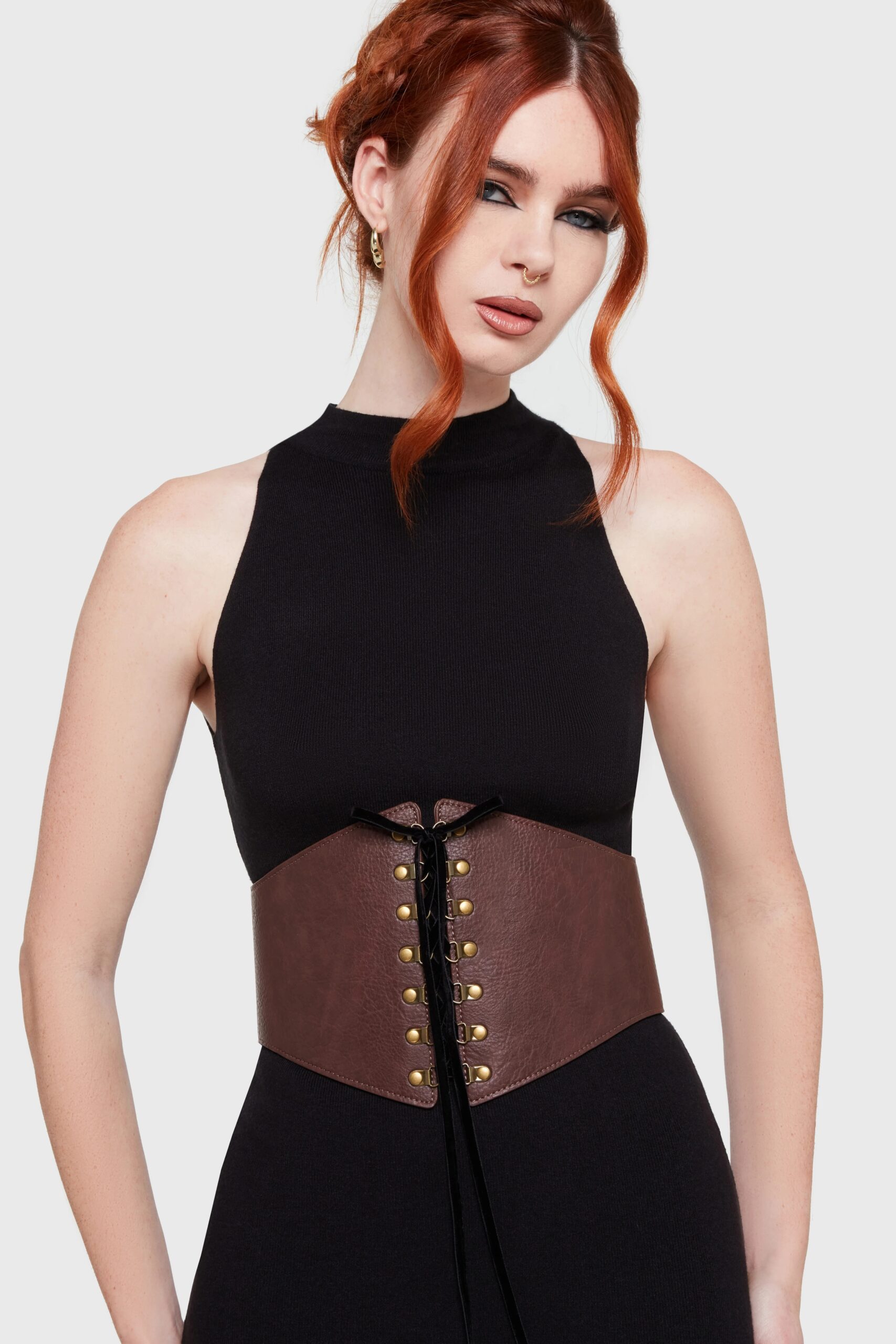 Front view of LaSuedeHub End of Night brown textured PU leather corset belt with black velvet lace-up detail on a black dress.
